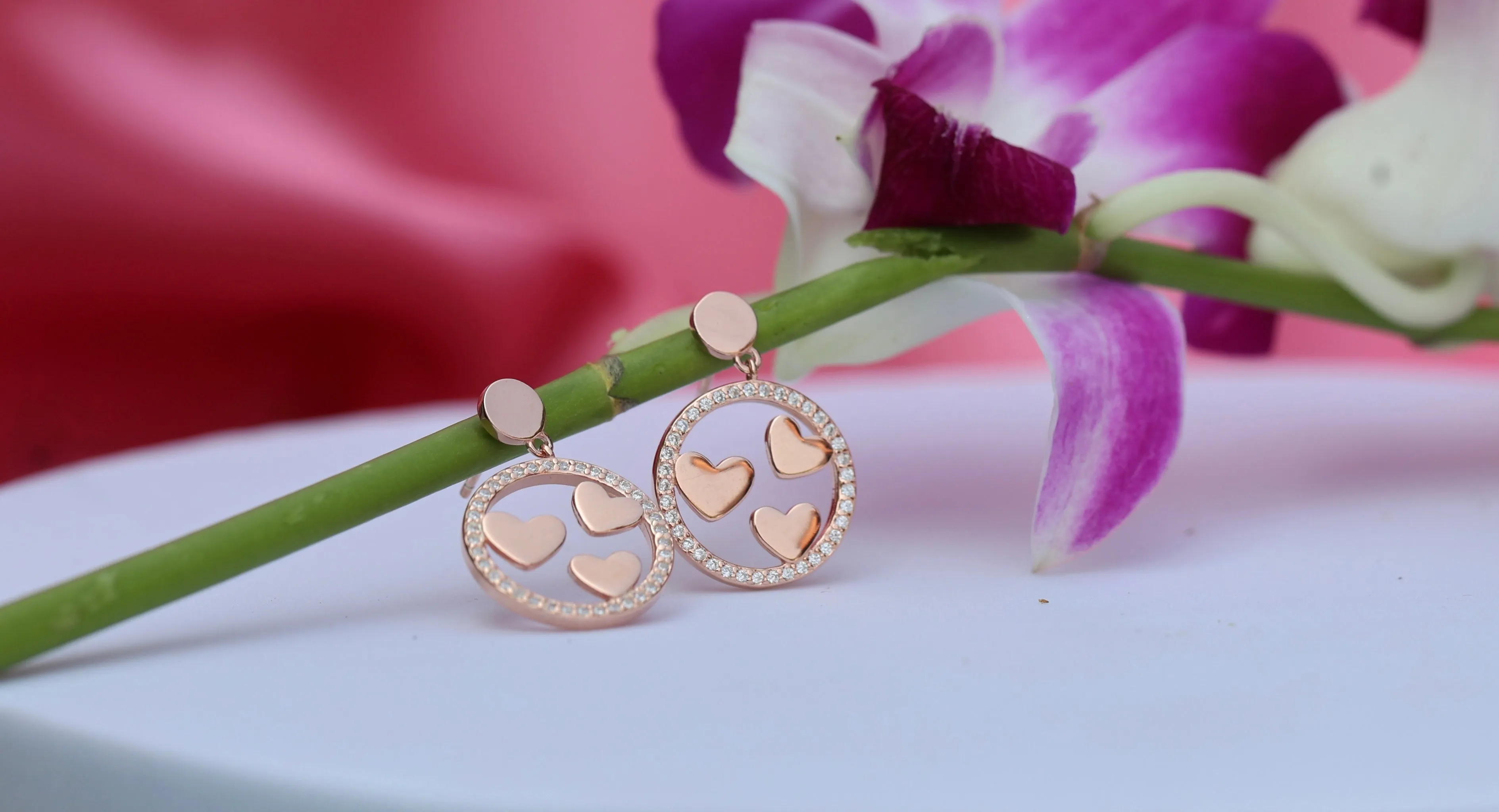 Triple heart rose gold drop earrings